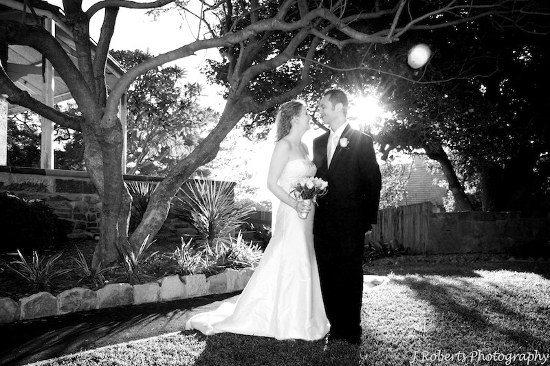 B&W of couple with sun behind - wedding photography sydney